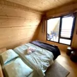 Single bedroom at Terrace Bakhmaro with sunlight streaming in from the window