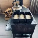 Baking 3 loaves of puri Georgian bread in the wood fire stove