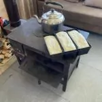 Baking 3 loaves of puri Georgian bread in the wood fire stove